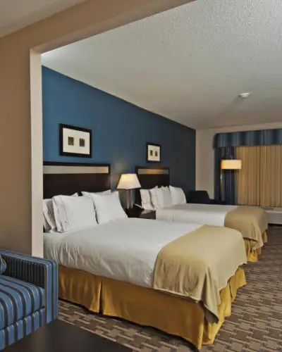 Interior of an accommodation room with two queen beds