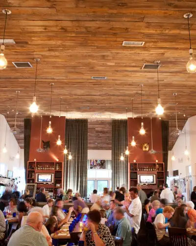 Interior of a restaurant with people dining